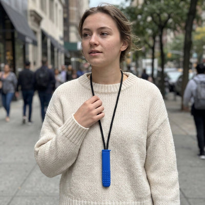 Woman wearing a Blueberry FreeAir on the neck lanyard