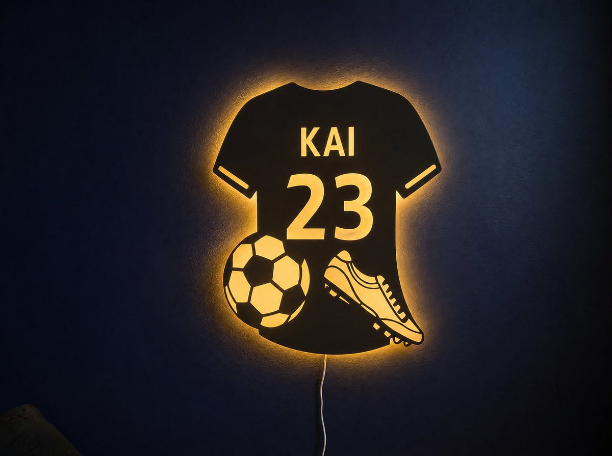 Kitglow jersey mirror glowing amber on a navy wall