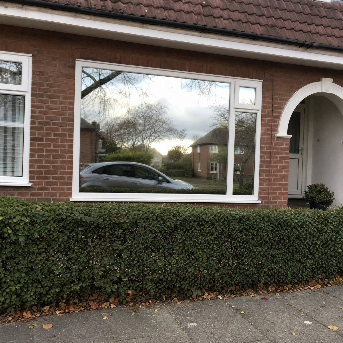 Window with mirror film seen from the street in daytime
