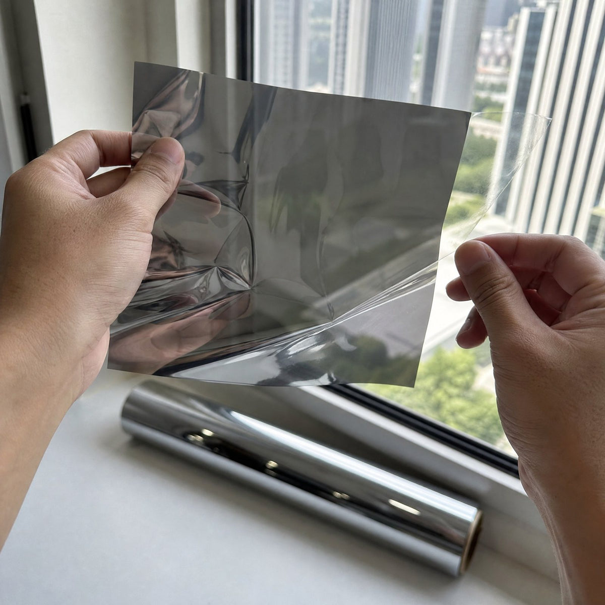 Thin sheet of one-way mirror film