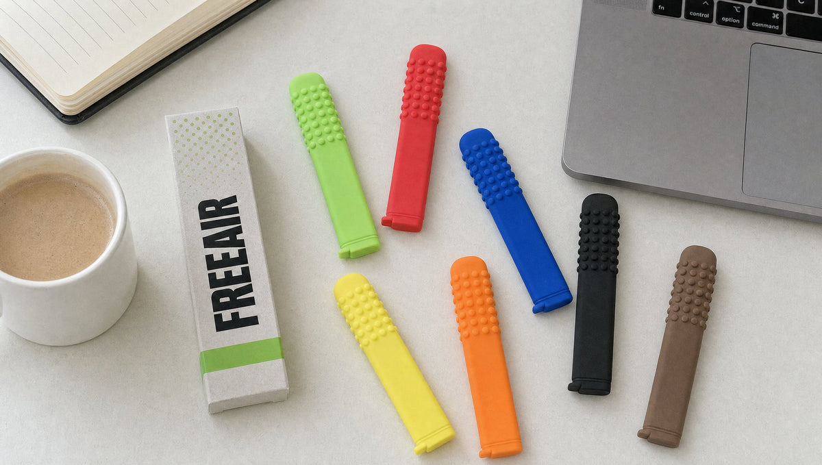 All 7 FreeAir flavors on a desk next to the box