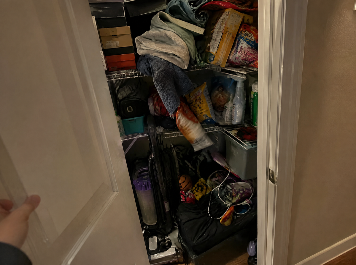 An overstuffed hallway closet