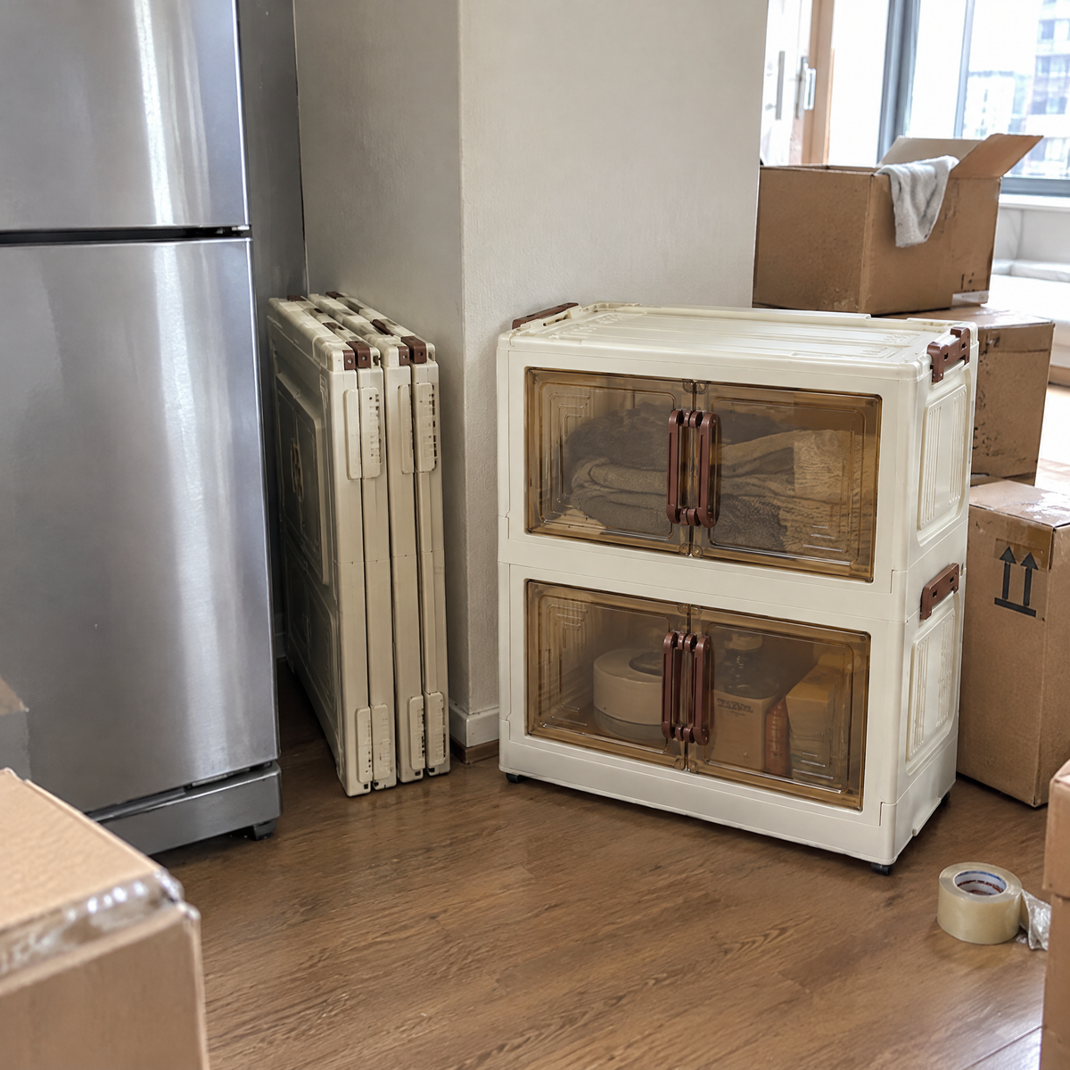 FoldNest cubes folded flat beside a fridge on moving day