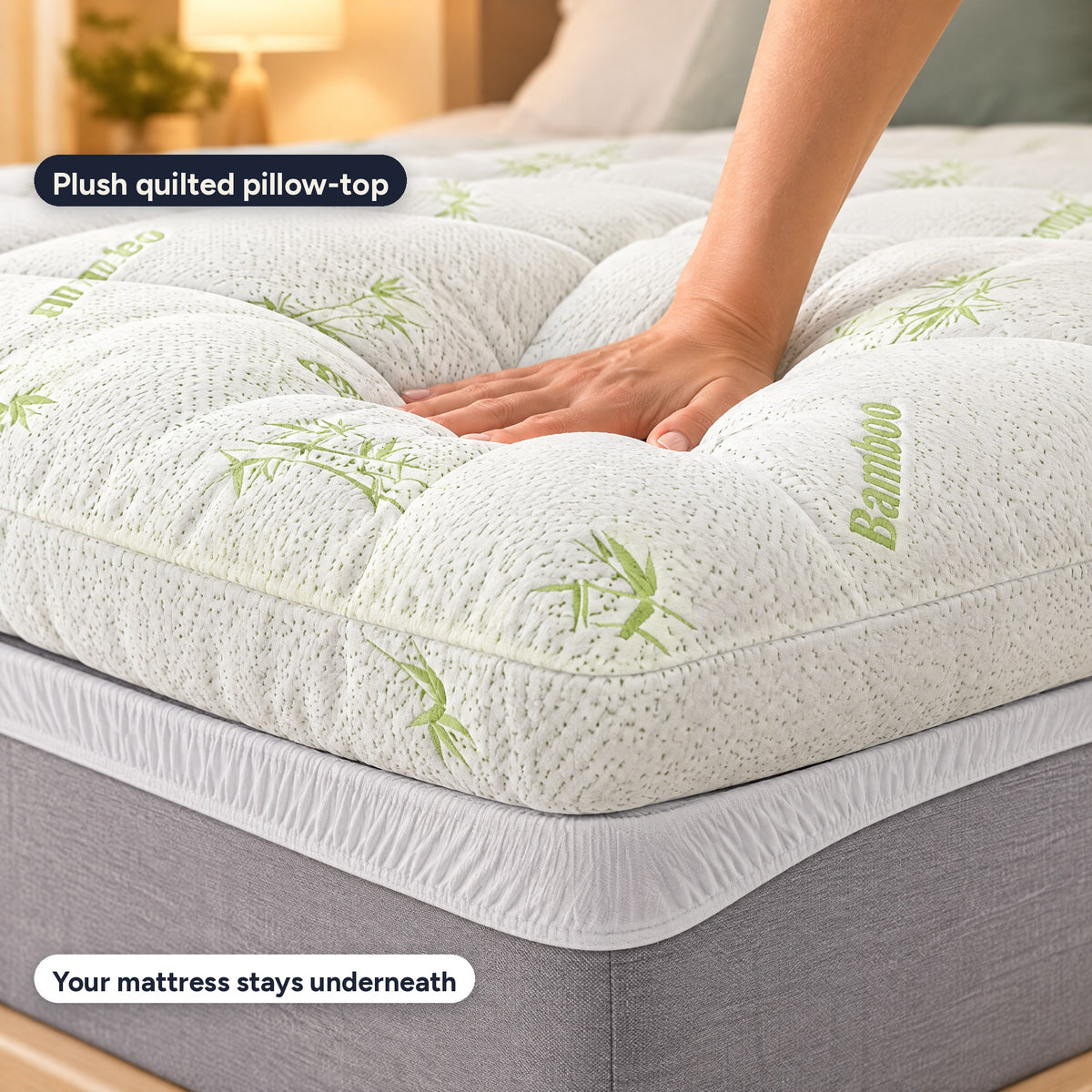 A hand sinking into the plush quilted pillow-top on top of a mattress