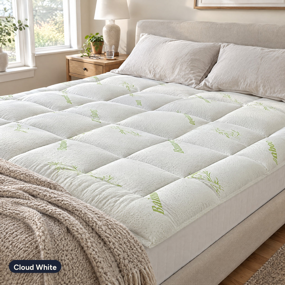 Cloud White Hushloft pillow-top on a bed in morning light