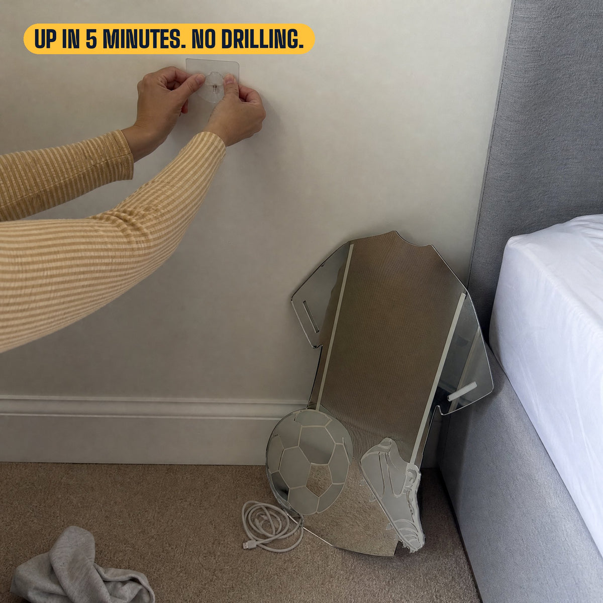 Pressing an adhesive hook to the wall, no drilling