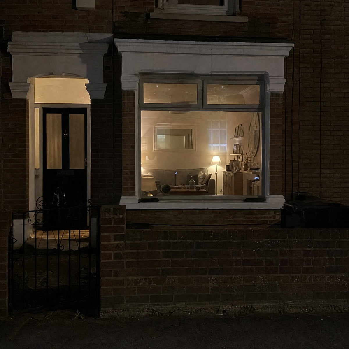 Window with film at night with lights on inside