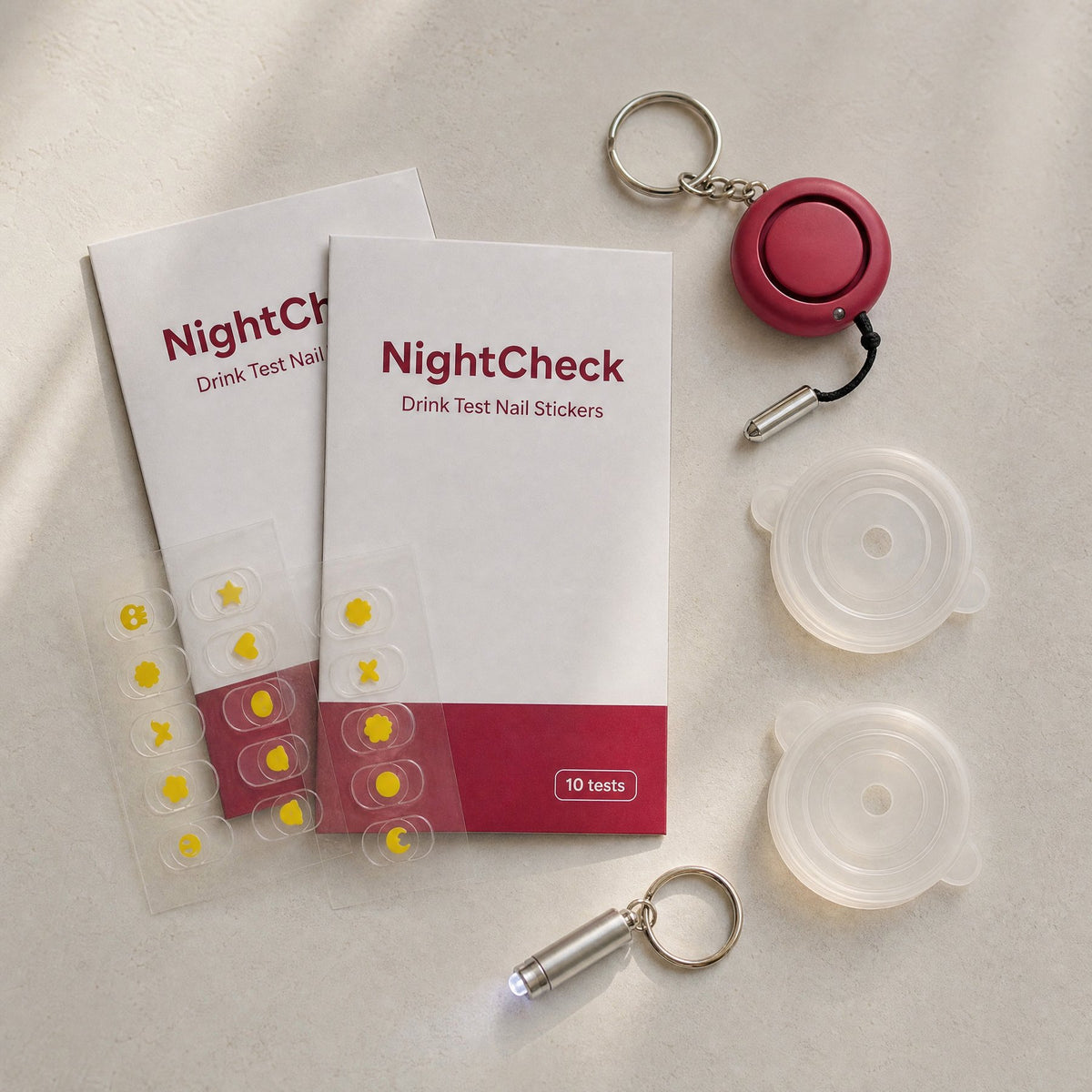 NightCheck Safety Kit: two sticker packs, safety alarm, two drink lids and a pocket light
