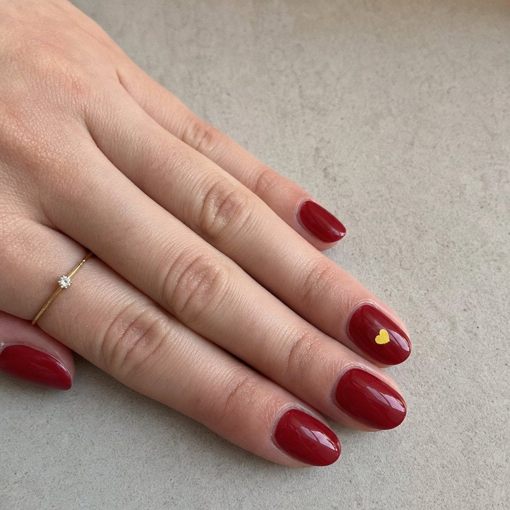 NightCheck sticker worn over red nail polish