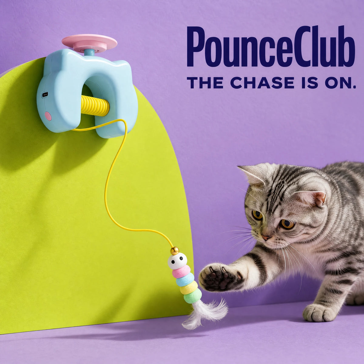 PounceClub automatic yo-yo cat toy in blue with a tabby cat