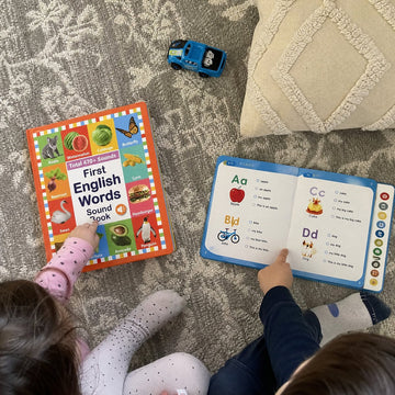 Sample customer photo: siblings with First Words and the Reader