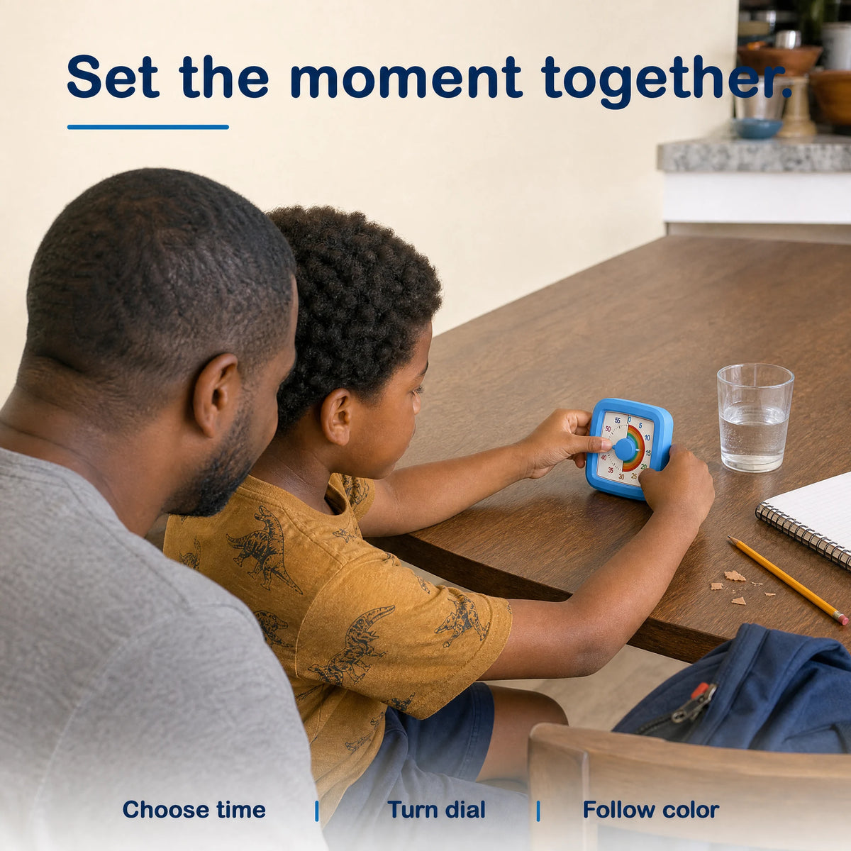 A parent and child set the Rainbow Time timer together
