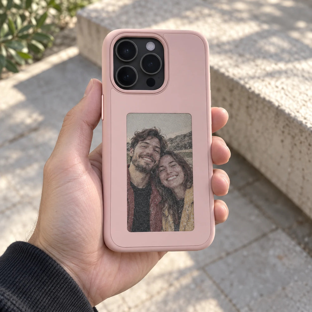 Reframe in Pink held in a hand with a personal photo design
