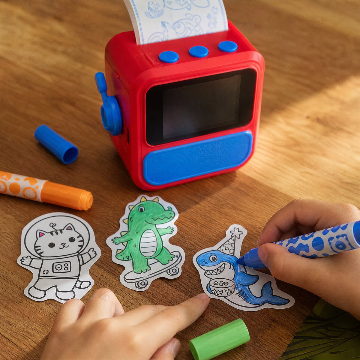 Child coloring printed stickers with markers