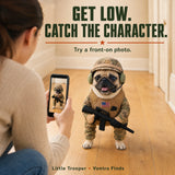 Owner photographing a pug in the costume from the front at dog height