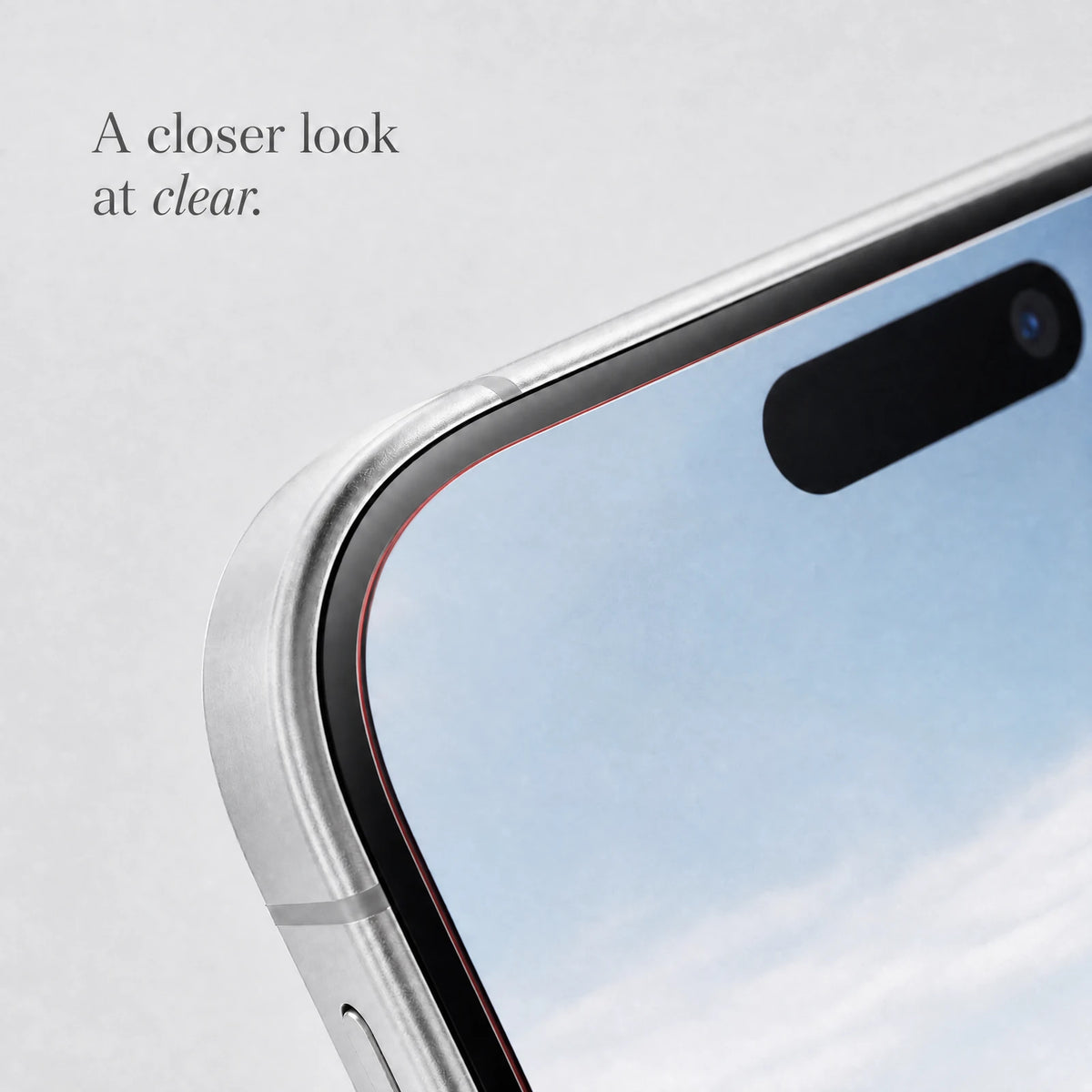 Close-up visualization of the thin clear glass edge and rounded phone corner; clear glass with a fine red edge.