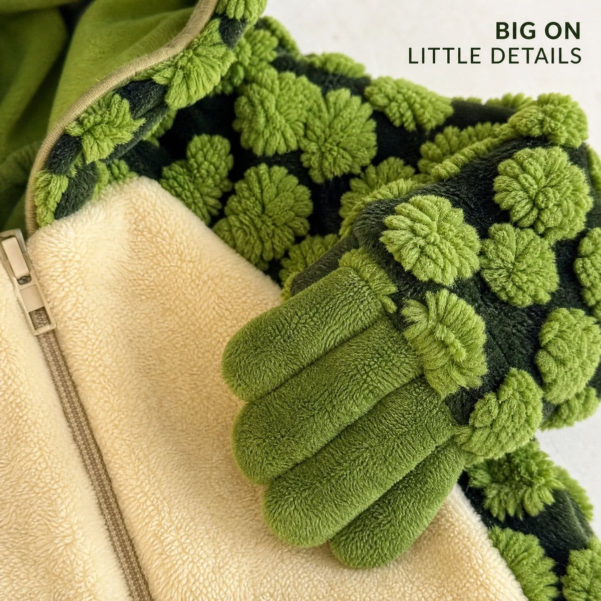 Close-up of plush texture and mitten-style hand