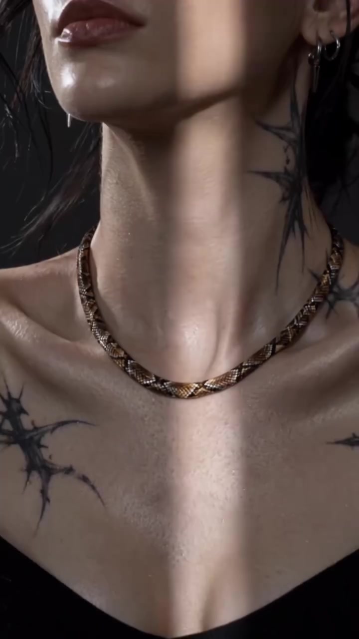 Snake-scale necklace worn around the neck